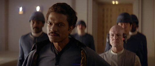 Lando Calrissian and Lobot greet Han Solo and Princess Leia Organa