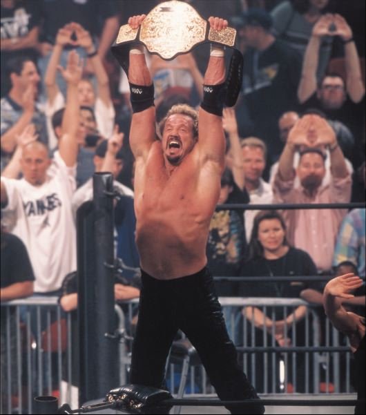 DDP raises his championship belt